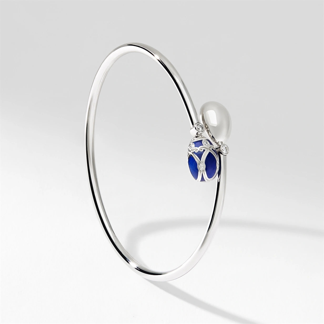 White Gold, Diamond & Blue Enamel Crossover Bracelet | Fabergé