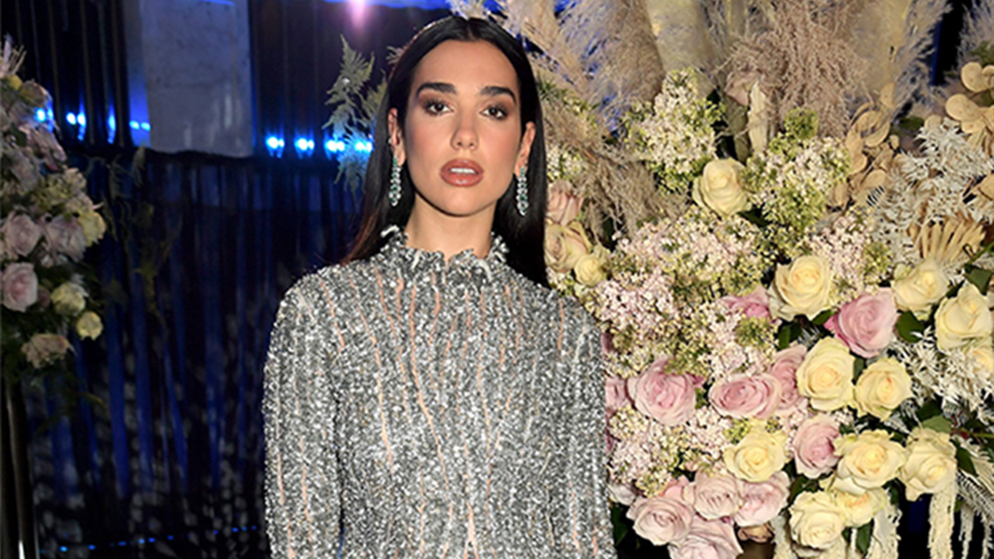 Dua-Lipa-wears-Fabergé-Treasures-Fire-Round-Demantoid-Garnet-&-Diamond-Ring-during-duet-with-Elton-John-Fabergé-29th-annual-Academy-Awards-Pre-Party