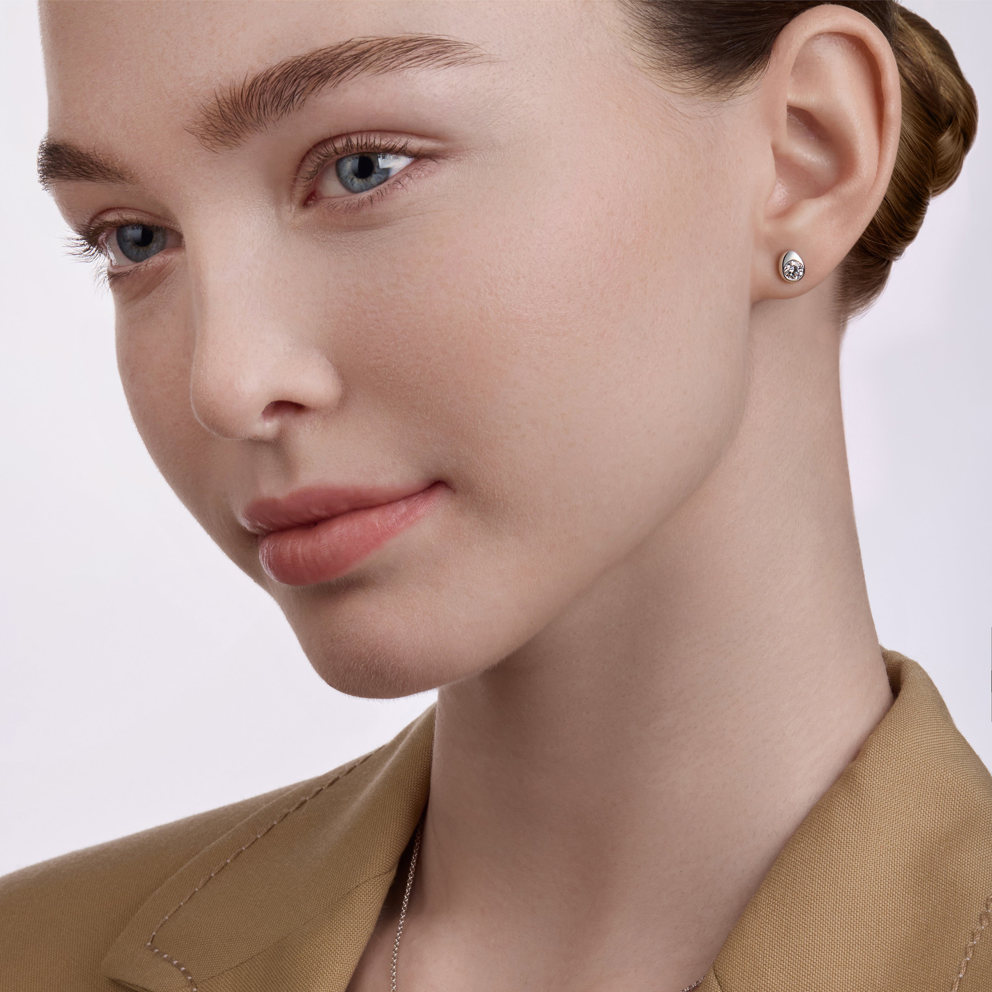 Faberge Model wearing Diamond Stud Earrings