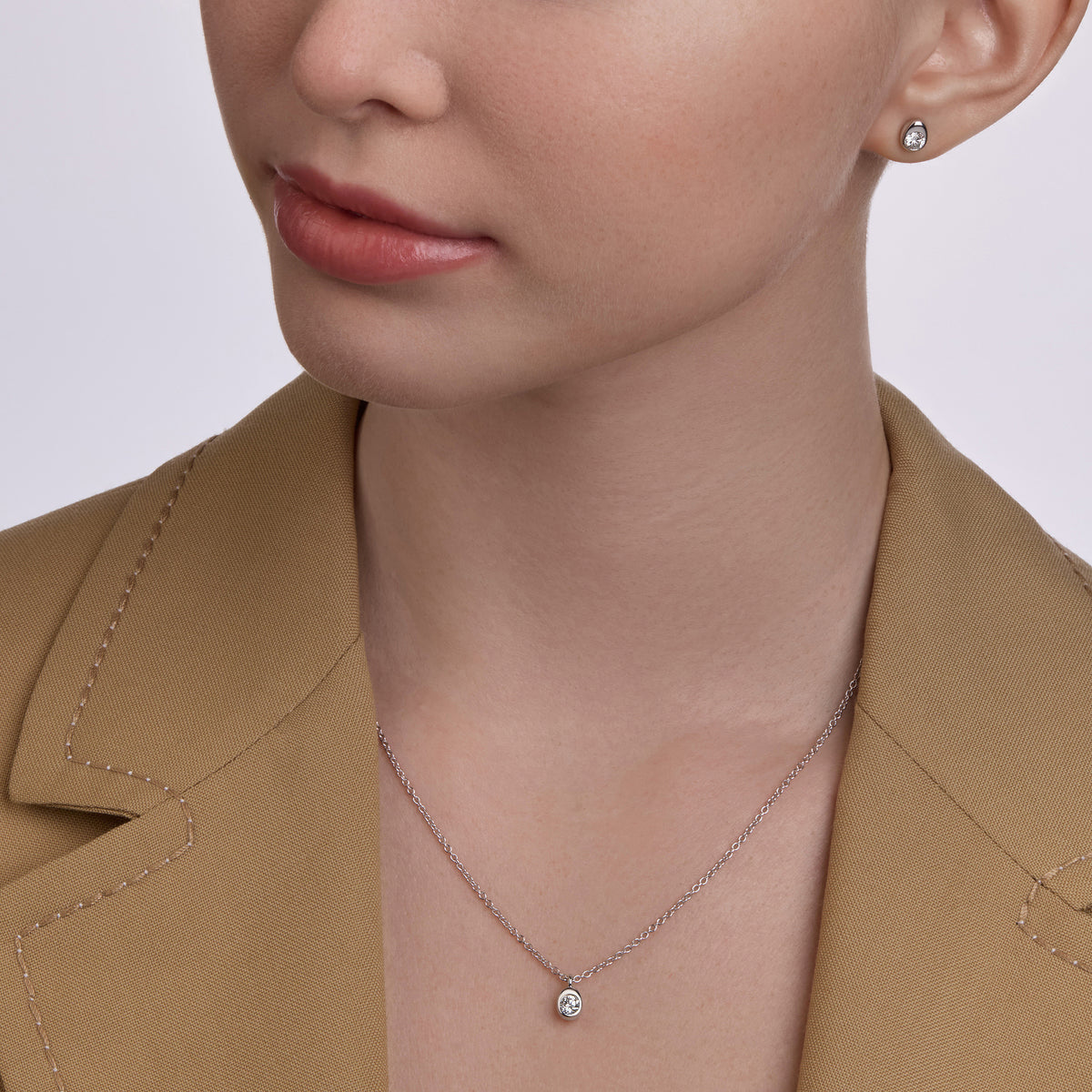 Faberge Model wearing Diamond Stud Earrings and Diamond Pendant Necklace